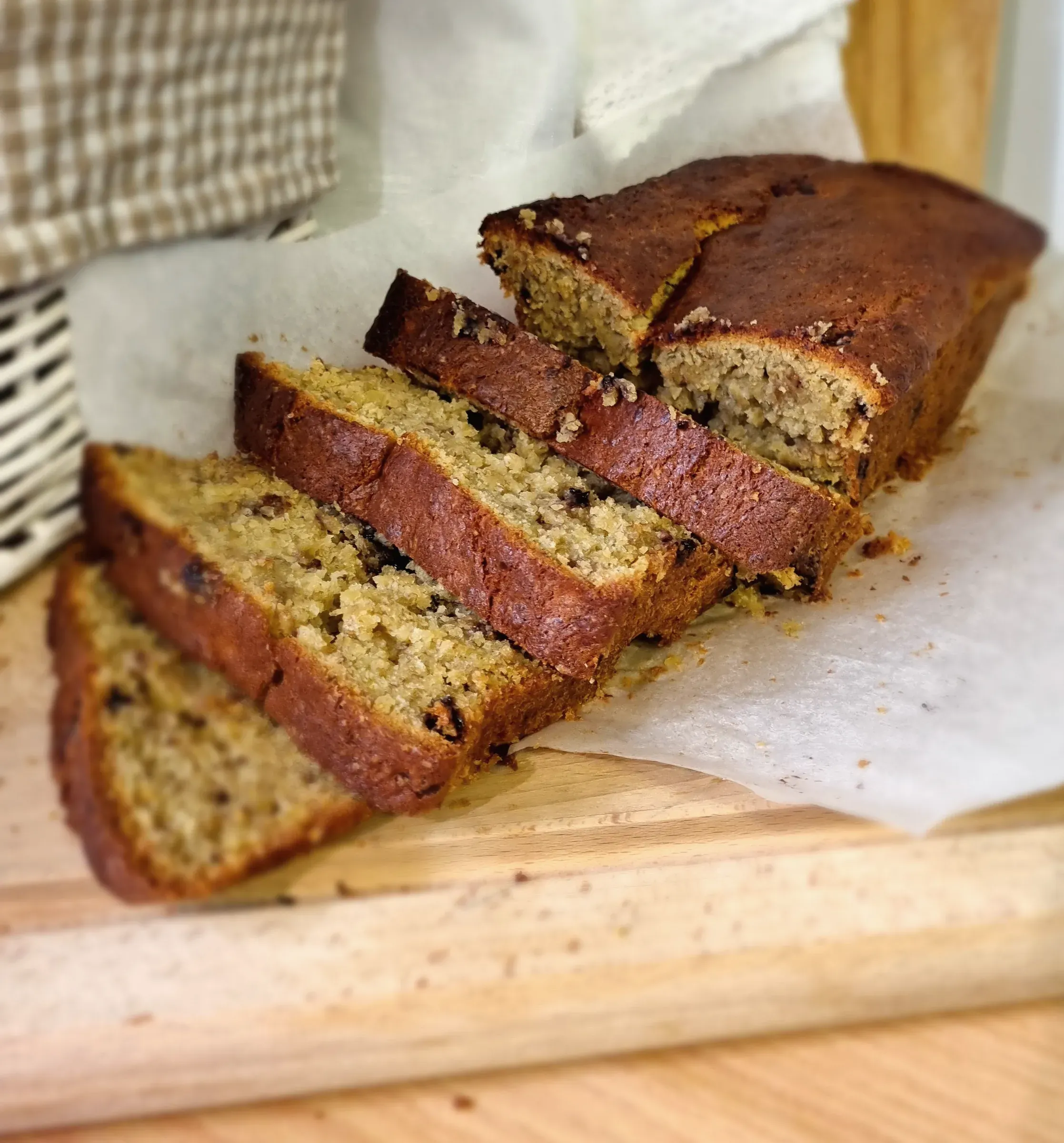 Thick slices of banana bread on a wooden board