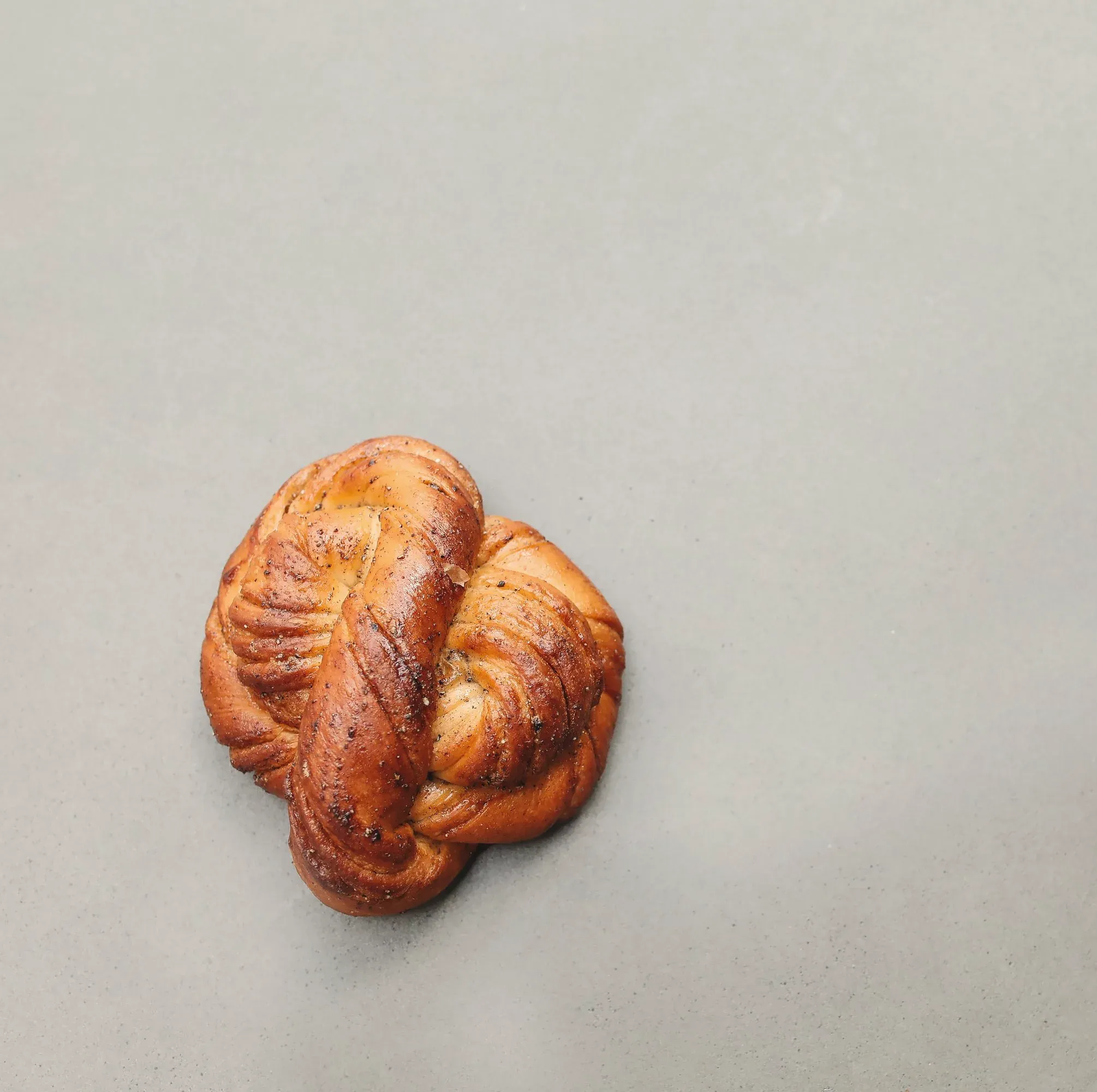 A twisted cardamom knot bun seen from above