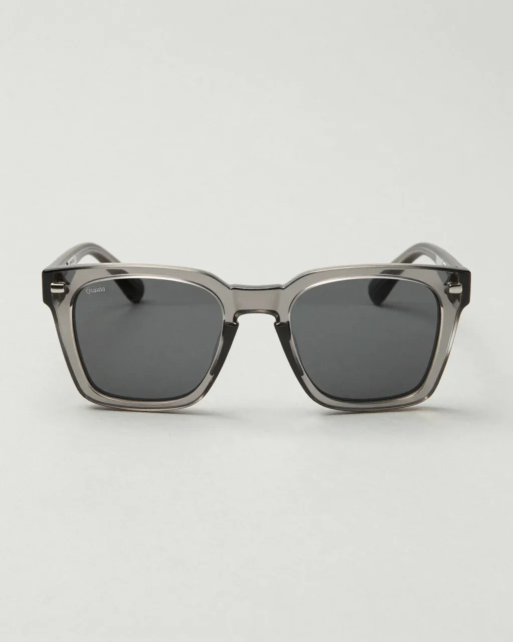 CORONA from the front, thick square sunglasses in clear grey acetate