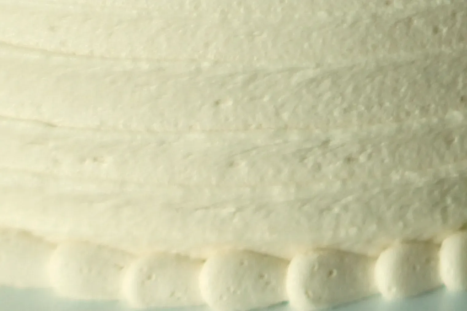 Piped Swiss buttercream on a cake, close up