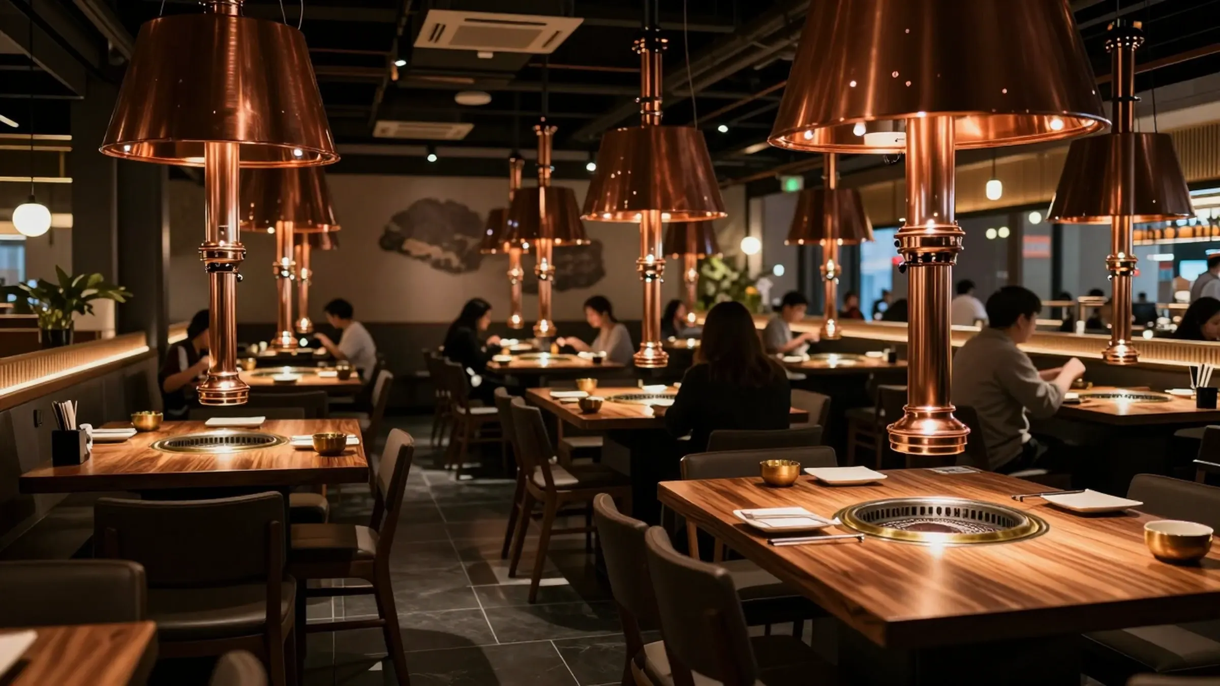 The Hwa Ro dining room at night, grills lit at every table