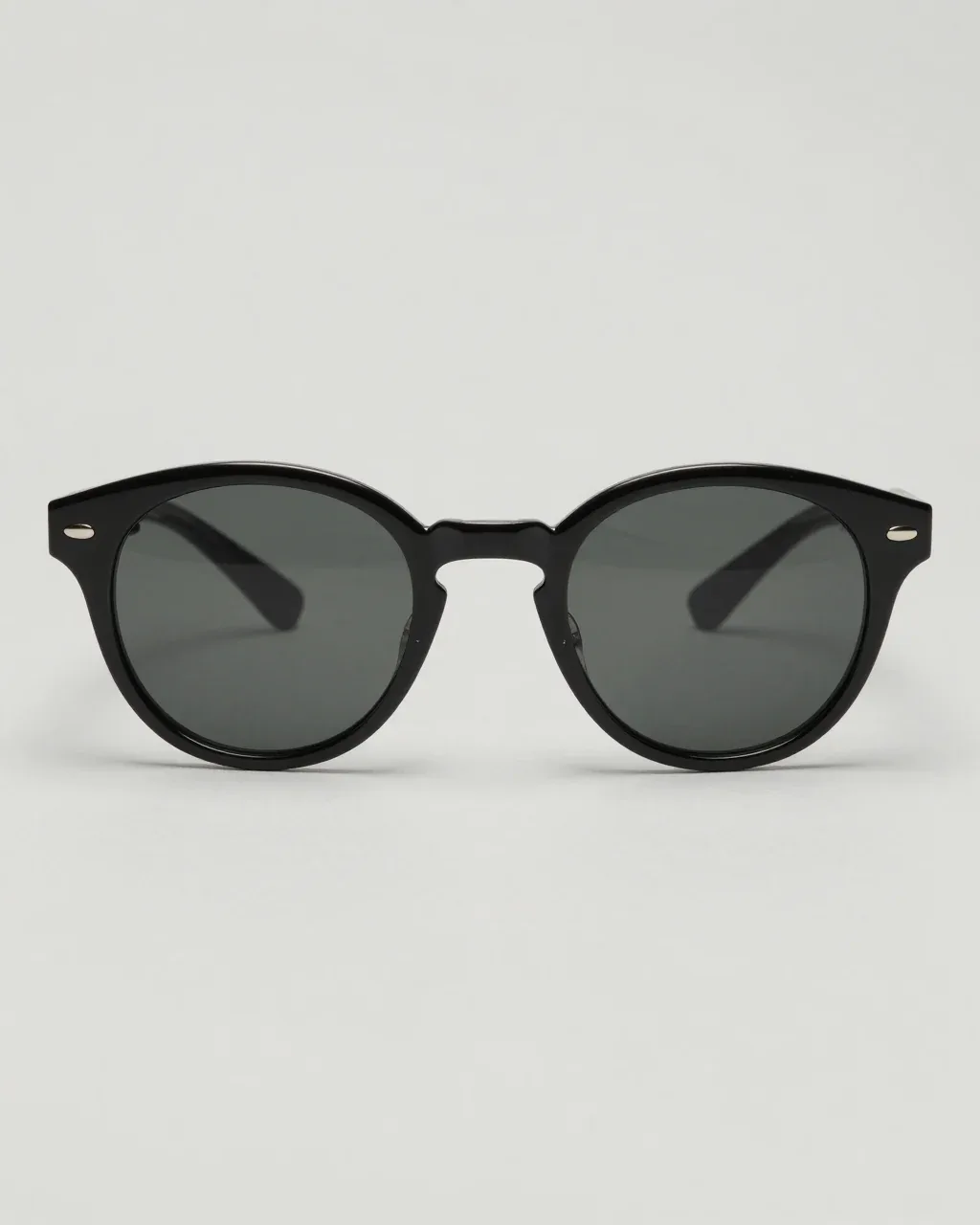 ECLIPSE 01 from the front, oversized round black acetate sunglasses with smoke lenses