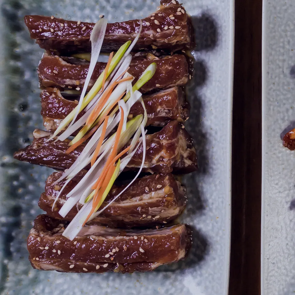 Marinated beef short rib strips with scallion and carrot