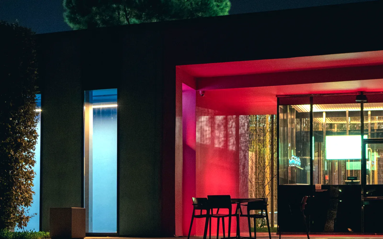 The Koreatown front at night, its entrance lit magenta