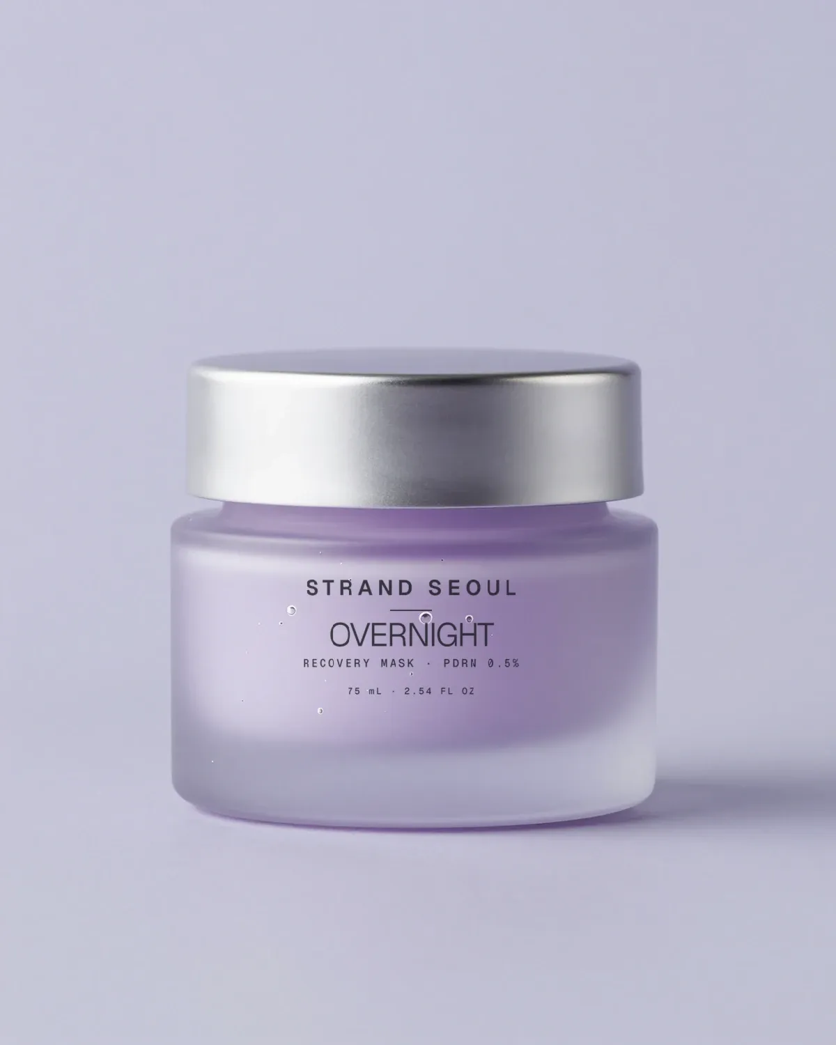 Overnight Recovery Mask: a wide frosted jar of lilac gel