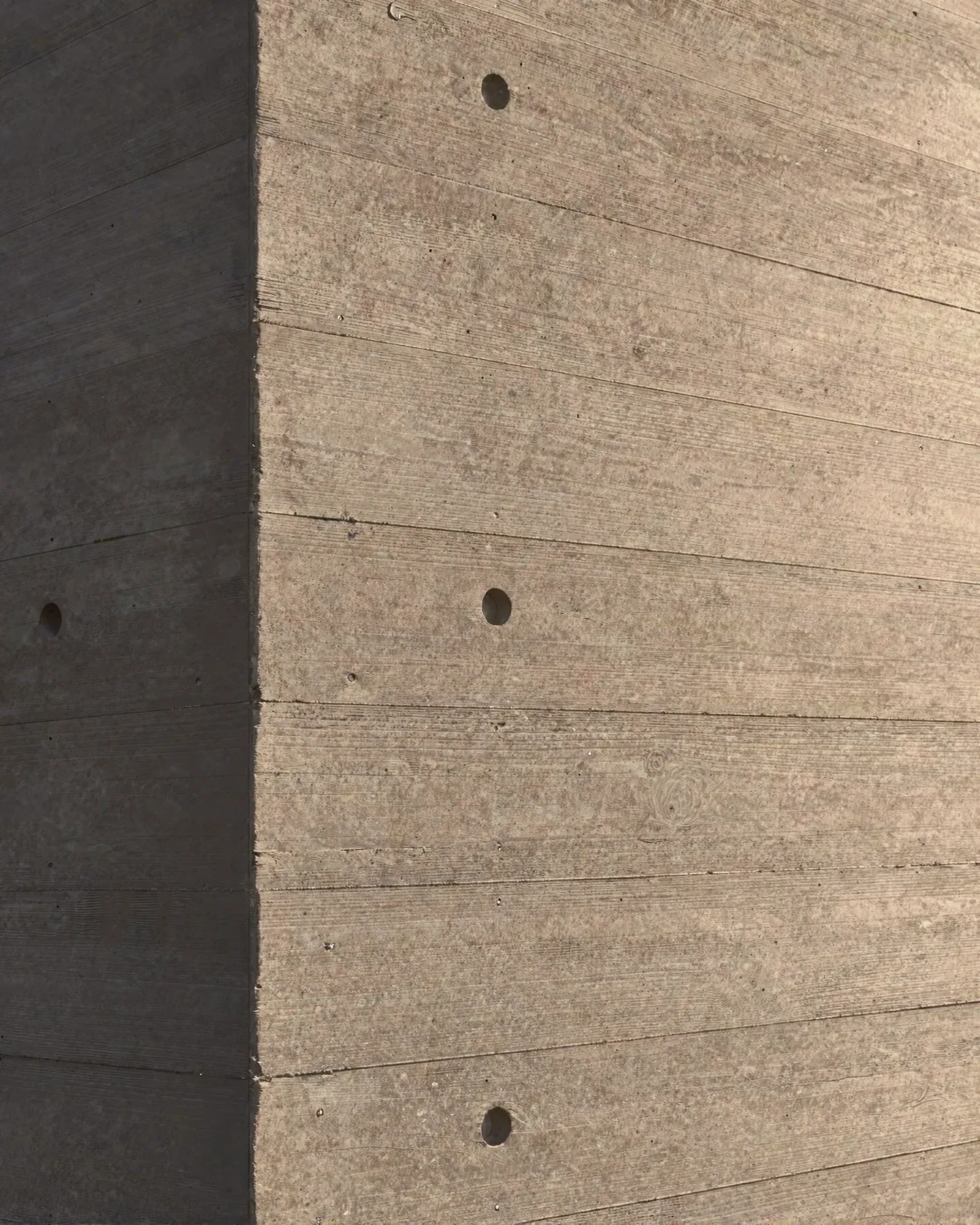 Concrete sample: board-formed in douglas fir, tie holes left open