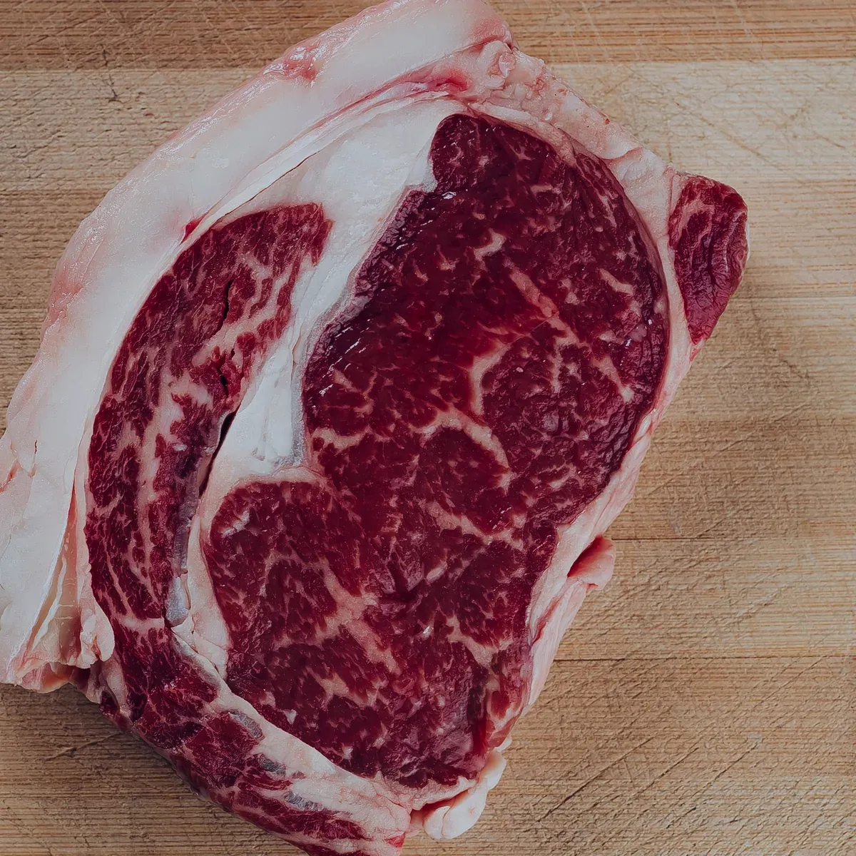 A thick marbled ribeye steak