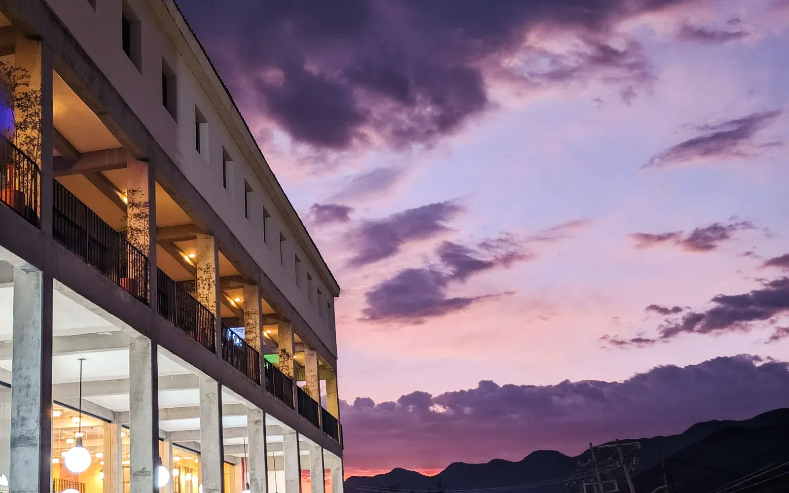The Torrance location: a strip of shops at dusk